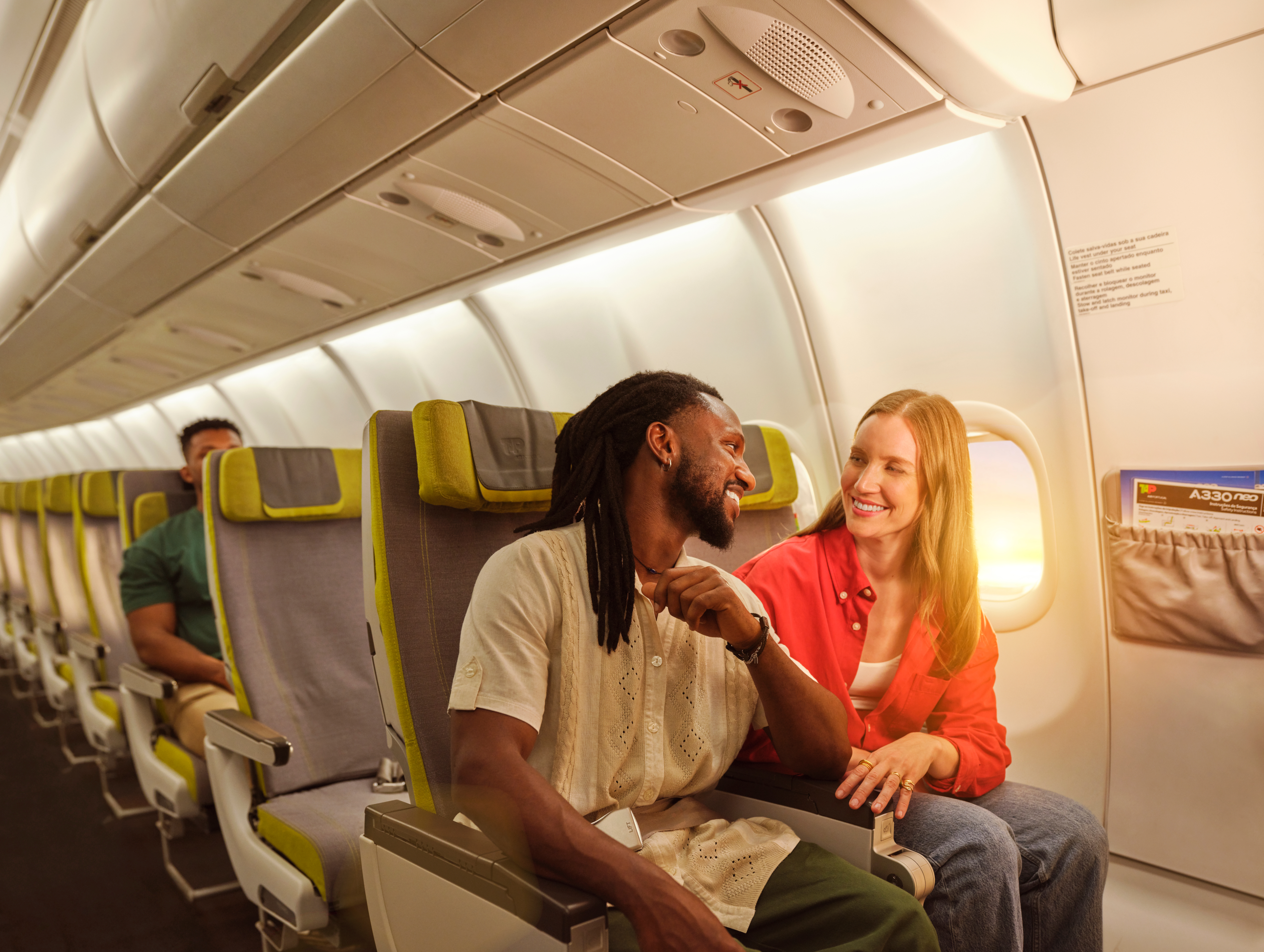 Passengers sitting inside an airplane cabin